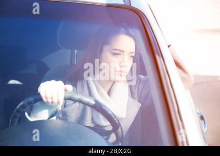 Young woman in car during traffic jam Stock Photo