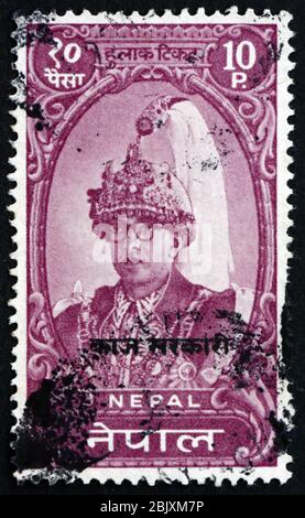 NEPAL - CIRCA 1962: a stamp printed in the Nepal shows King Mahendra, King of Nepal, circa 1962 Stock Photo