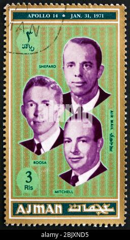 AJMAN - CIRCA 1971: a stamp printed in Ajman shows Shepard, Roosa and Mitchel, Astronauts, Apollo 14, circa 1971 Stock Photo