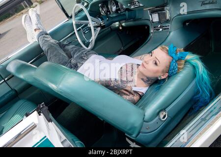 Ford Thunderbird low rider with LA Gang style girl Stock Photo