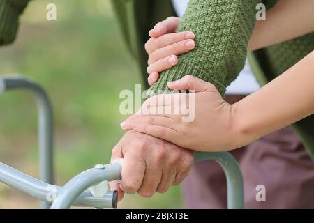 Elderly man with daughter in park, closeup Stock Photo