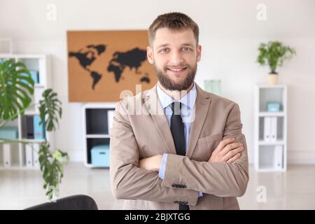 Male travel agent in office Stock Photo