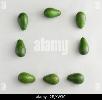 Frame made of ripe avocados on white background Stock Photo