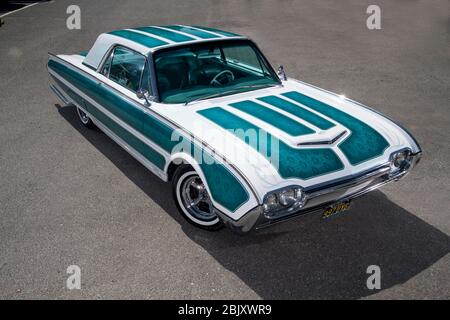Ford Thunderbird low rider with LA Gang style girl Stock Photo