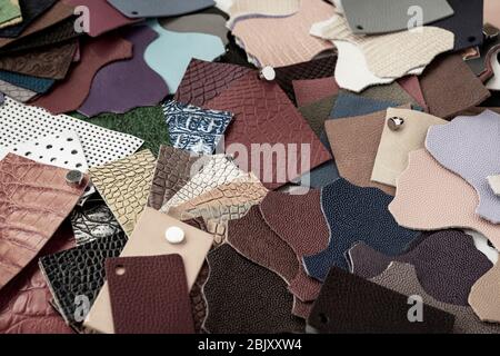 Set of multi-colored pieces of genuine leather of different textures, color samples for choice, shopping and industry concept Stock Photo
