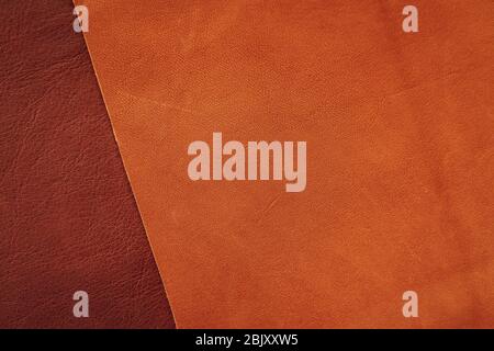 Brown and tan colors matte leather samples close-up, abstract background, texture. Shopping and industry concept Stock Photo