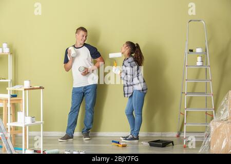 Happy young couple doing repair in their new house Stock Photo