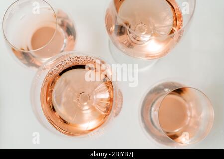 Glasses of rose wine on white background Stock Photo