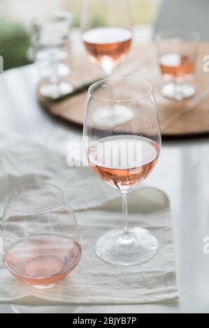 Glasses of rose wine on table Stock Photo