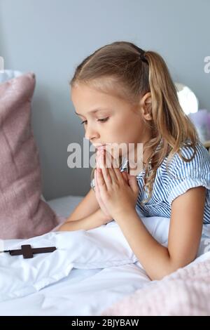 Throw Pillow Portrait of a girl praying 