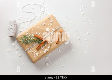 Beautiful Christmas gift box with threads on white background Stock Photo