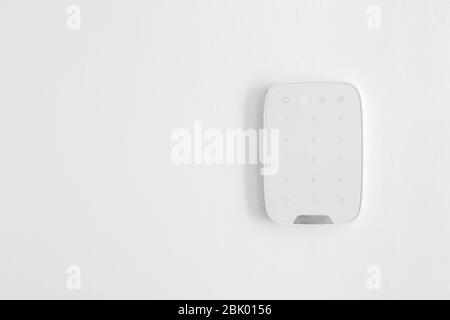 Panel of modern security system on wall indoors Stock Photo