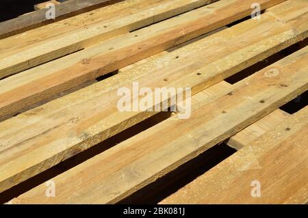 Sturdy wooden pine pallet used in transportation and storage, euro pallet, epal pallet, isolated on black background Stock Photo