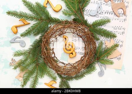 Composition with note sheets and Christmas decor on light background Stock Photo
