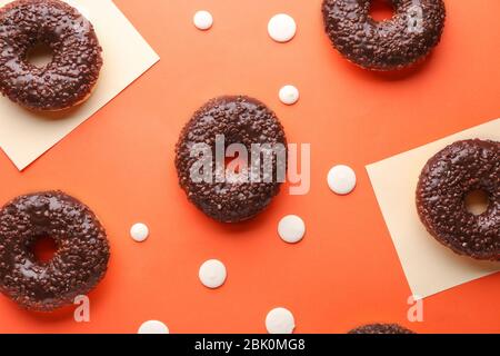Sweet tasty donuts on color background Stock Photo