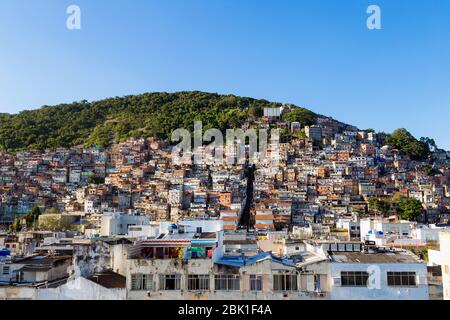 Favela of Rio de Janeiro, Brazil. Colorful houses in a hill. Zona Sul of Rio. Poor neighborhoods of the city.