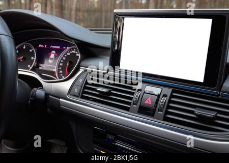 Monitor in car with isolated blank screen use for navigation maps and GPS rearview camera and parking assistant. Isolated on white with clipping path Stock Photo