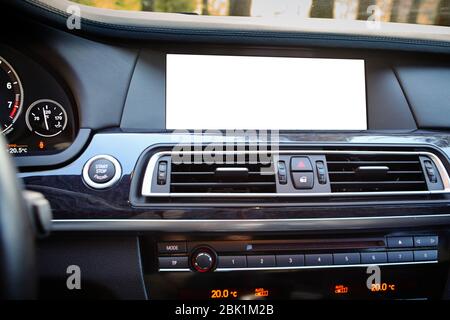 Monitor in car isolated blank screen for navigation maps and GPS rearview camera and parking assistant. Isolated on white with clipping path Car displ Stock Photo