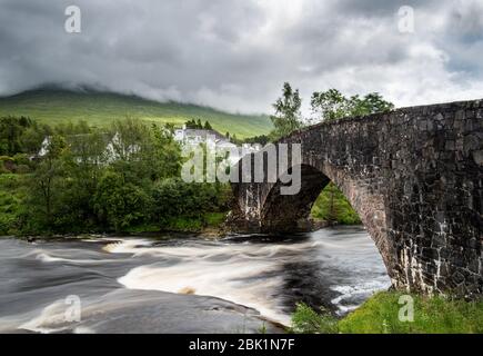 The bridge of orchy in Argyll and Bute with the river orchy in the central highlands of Scotland, United Kingdom Stock Photo