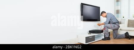 Tv Install Box Technician Installing TV Box. Install And Repair Service Man Stock ...