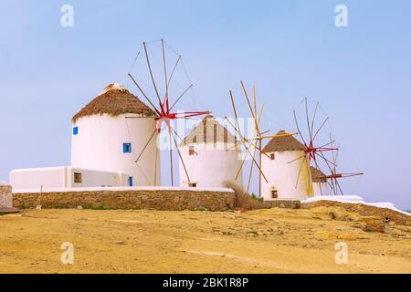 Greek iconic windmills panoramic background in Mykonos, Greece, famous island in Cyclades Stock Photo