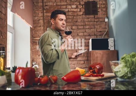 Man holding a wineglass in his hand Stock Photo
