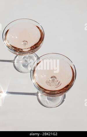 Glass of sparkling wine on the white table Stock Photo