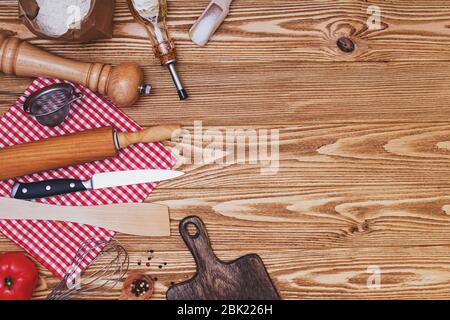 Cooking utensils on wooden background, top view. Stock Photo