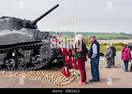 People visiting Torcross Sherman D Day Tank memorial, Slapton Sands, Devon, UK Stock Photo