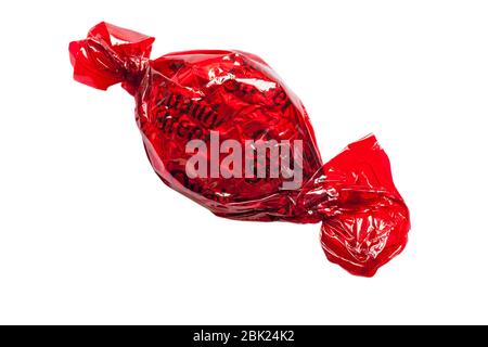 Quality Street chocolate by Nestle – strawberry delight chocolate, red Quality Street, isolated on white background Stock Photo