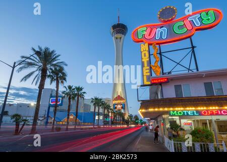 View of Fun City Motel and Stratosphere Tower at dusk, 'The Strip' Las Vegas Boulevard, Las Vegas, Nevada, USA, North America Stock Photo