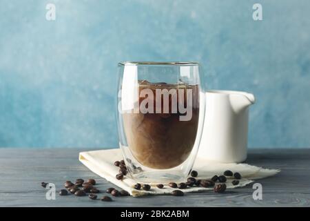 Composition with glass of ice coffee on wooden background Stock Photo