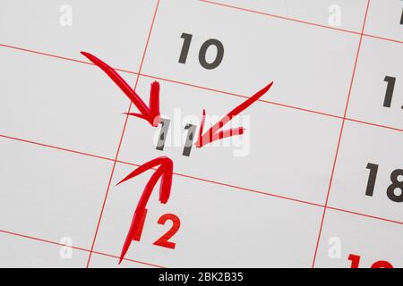 11th Date of the Month marked in red marker pen on a simple planner calendar Stock Photo