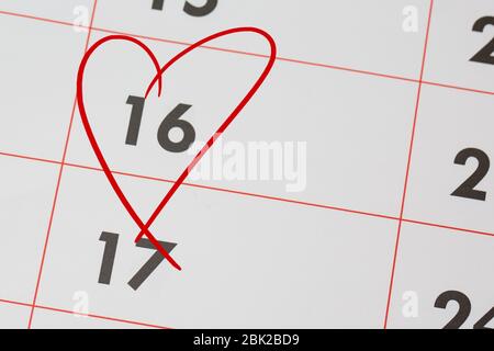 16th Date of the Month marked in red marker pen on a simple planner calendar Stock Photo