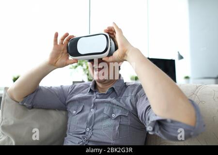 Guy using VR at home Stock Photo