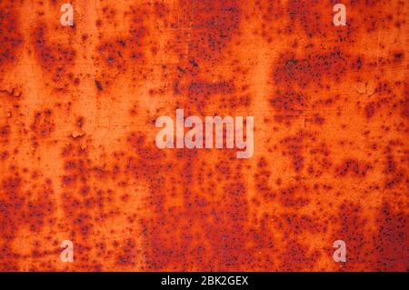 An old, rusty, colored plate with traces of background painting Stock Photo