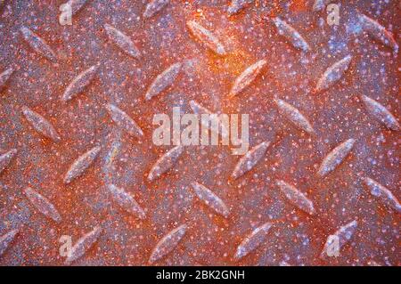 An old, rusty, colored plate with traces of background painting Stock Photo
