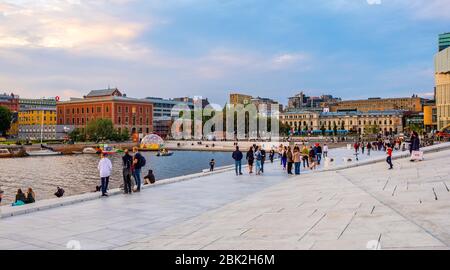 Oslo, Ostlandet / Norway - 2019/08/31: Panoramic view of Bjorvika district at Oslofjord sea waterfront with Havnepromenade boulevard and Sentralstasjo Stock Photo