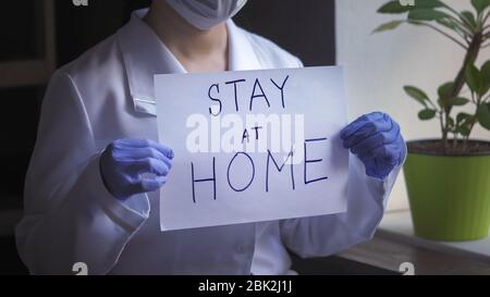Doctor Hands In Disposable Gloves Holding Paper Blank Stock Photo