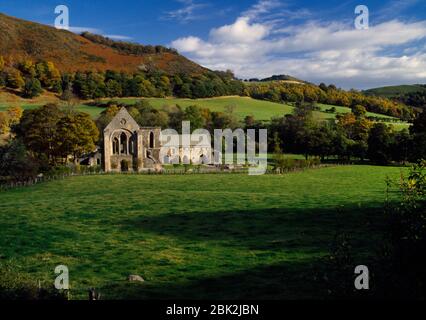 Valle Crucis Abbey, Llangollen, Wales, UK, looking SE to the C13th ruins of Castell Dinas Brân on the hill beyond. Abbey founded 12 January 1201. Stock Photo