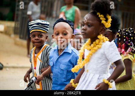 Abidjan, Ivory Coast - February 13, 2018: Portrait of a little boy in traditional embroidered clothes and black and white stripe with a hat of the sam Stock Photo