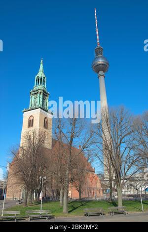 Belltower of St. Mary's Church or Marienkirche and TV tower at Alexanderplatz Berlin, Germany Stock Photo