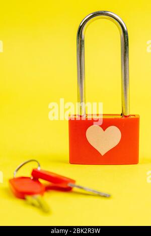 Red lock with drawing heart and key on yallow background Stock Photo