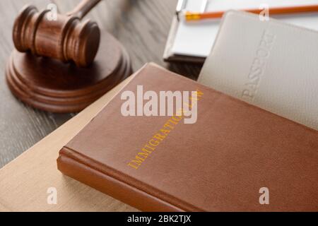 Judge's gavel, book and documents on wooden table Stock Photo