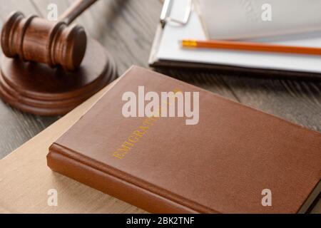 Law book, gavel and documents on wooden table Stock Photo
