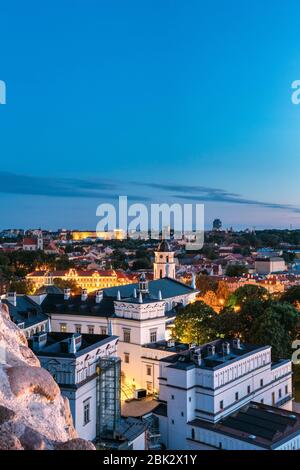 Vilnius, Lithuania, Eastern Europe. Aerial View Of Historic Center Cityscape In Blue Hour After Sunset. Travel View Of Old Town In Night Illuminations Stock Photo