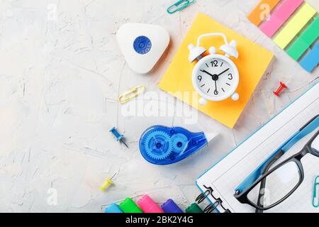 Stationery for school and creative work are on a gray background. Stock Photo