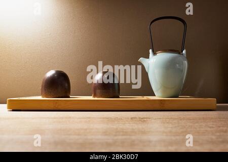 Chinese teapot and tea cups on the table stock image Stock Photo