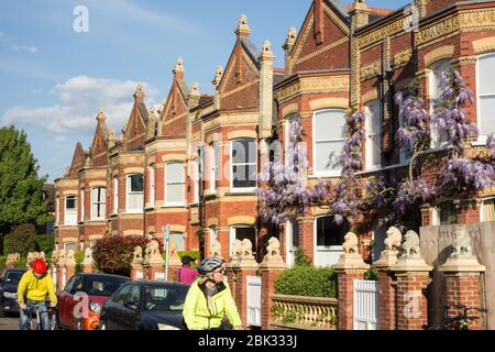 Lion statues on the gables and gateposts of Wisteria clad Lion Houses in Barnes, London, SW13, UK Stock Photo