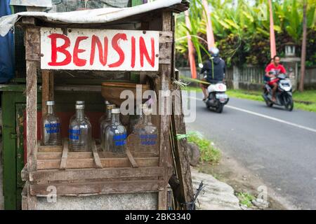 Petrol station near Ubud selling petrol in vodka bottles Bali, Indonesia Stock Photo